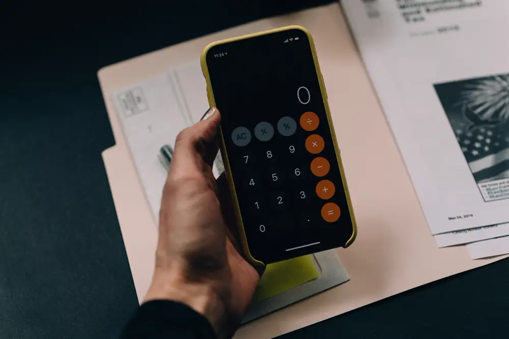 Working out a budget on a phone calculator